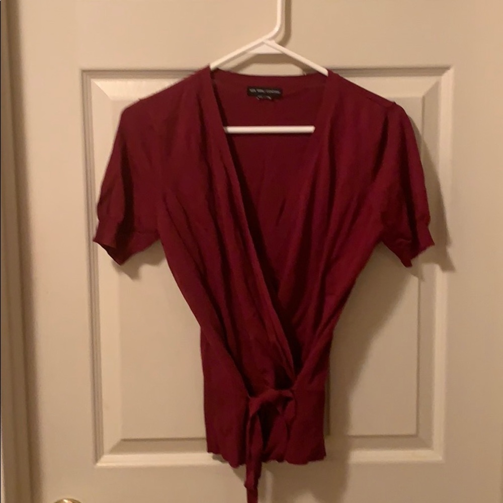 Large, tied sweater.